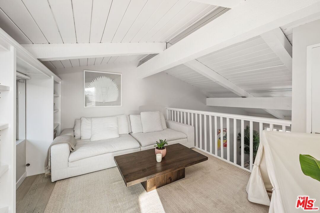 28378 Rey De Copas Lane Malibu, CA 90265 - Photo 19 of 45 a living room with furniture and a chandelier