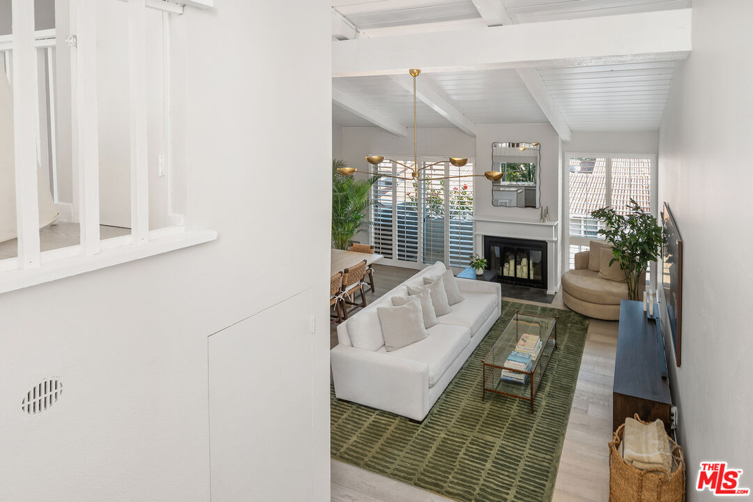 28378 Rey De Copas Lane Malibu, CA 90265 - Photo 25 of 45 a living room with furniture and a fireplace