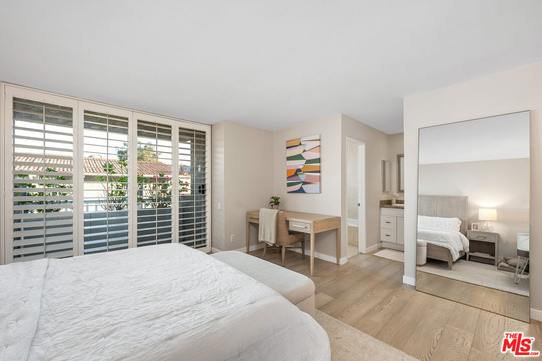 28378 Rey De Copas Lane Malibu, CA 90265 - Photo 28 of 45 a bedroom with a bed and a large window