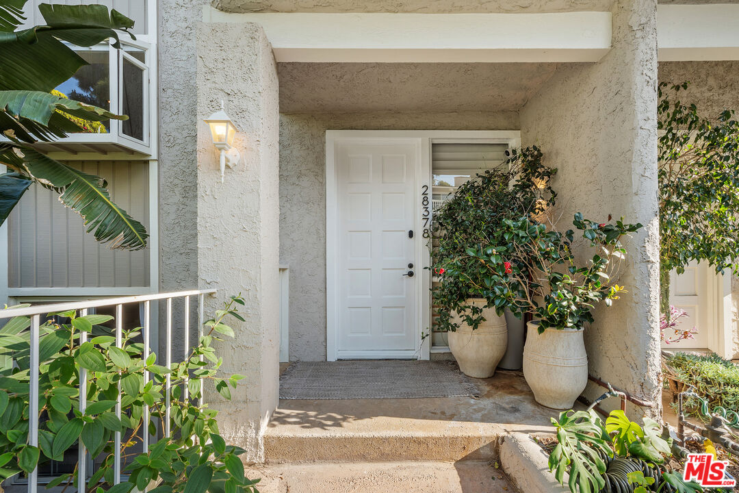 28378 Rey De Copas Lane Malibu, CA 90265 - Photo 3 of 45 a view of a entryway door of the house