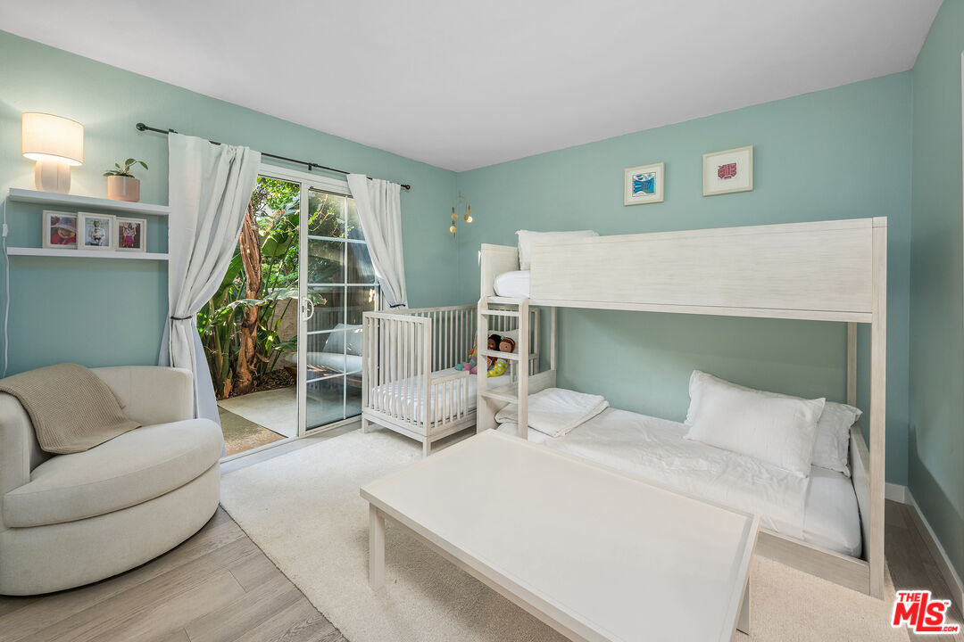 28378 Rey De Copas Lane Malibu, CA 90265 - Photo 32 of 45 a bedroom with a bed and a couch