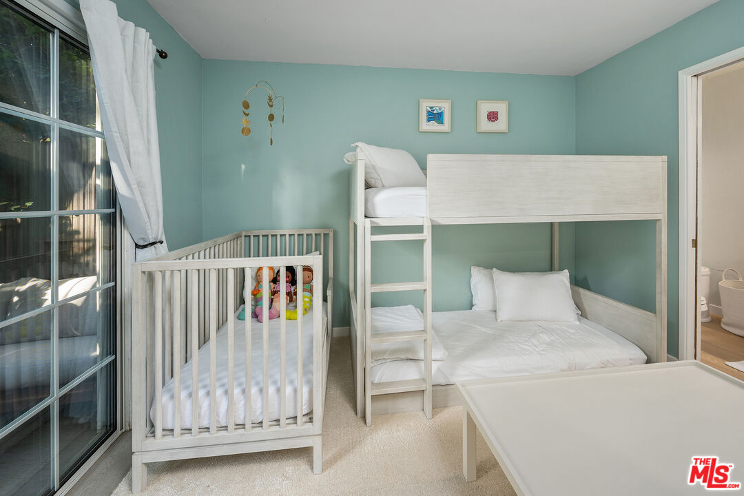 28378 Rey De Copas Lane Malibu, CA 90265 - Photo 33 of 45 a bedroom with a bed and a window