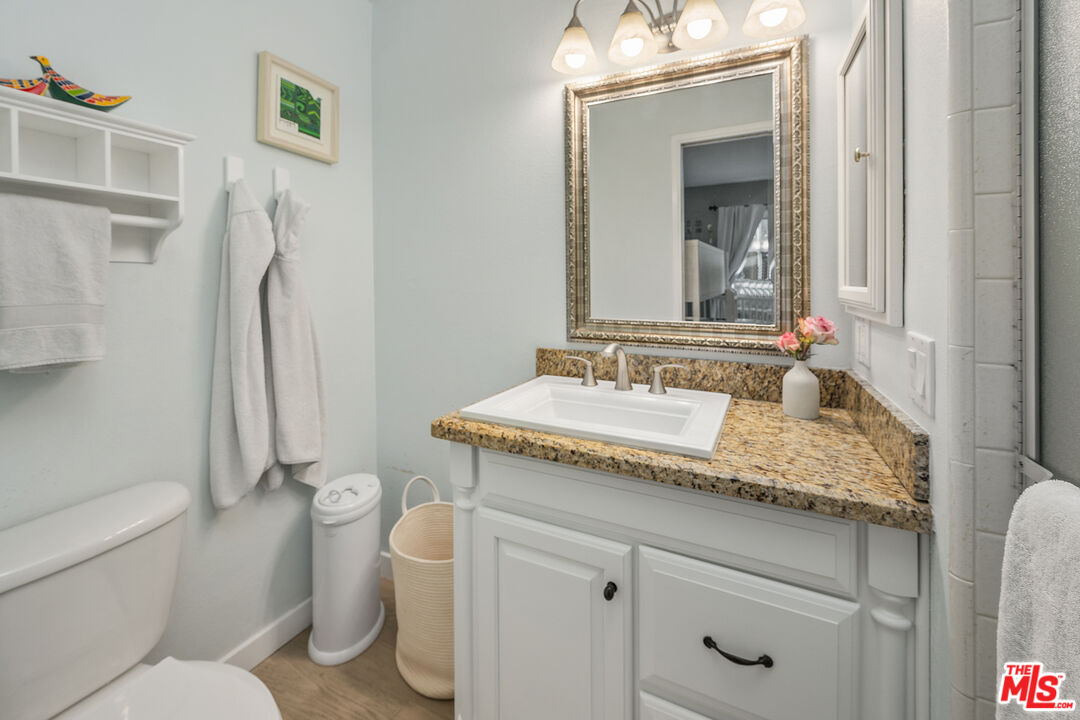 28378 Rey De Copas Lane Malibu, CA 90265 - Photo 34 of 45 a bathroom with a granite countertop sink toilet and shower