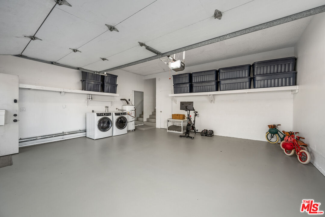28378 Rey De Copas Lane Malibu, CA 90265 - Photo 39 of 45 a utility room with furniture and a ceiling fan