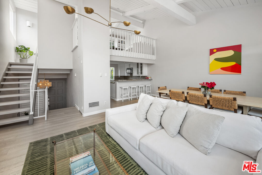 28378 Rey De Copas Lane Malibu, CA 90265 - Photo 7 of 45 a living room with furniture and a kitchen view