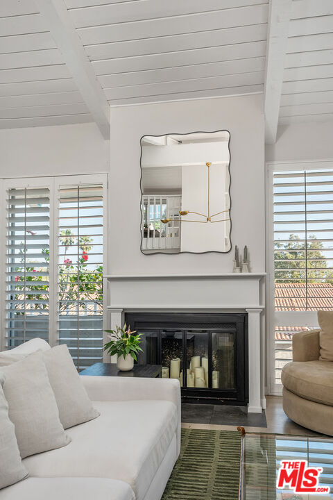 28378 Rey De Copas Lane Malibu, CA 90265 - Photo 10 of 45 a living room with furniture and a fireplace