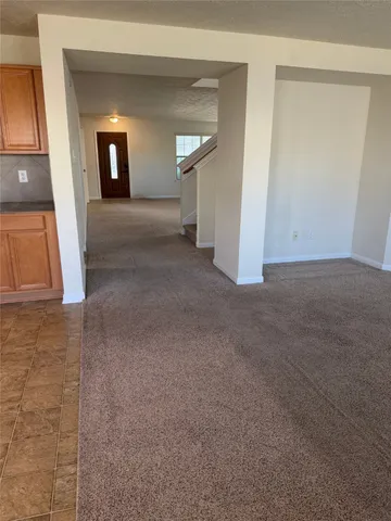 a view of a livingroom and a fireplace