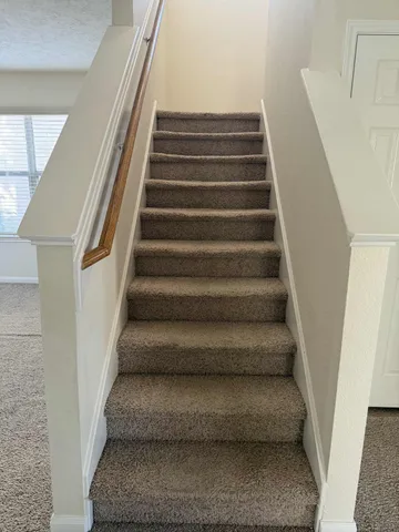 a view of staircase with empty racks