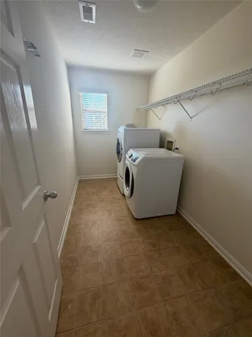 a view of a hallway to rooms