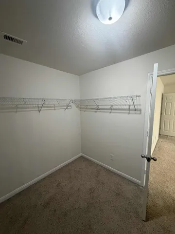 a view of a room with racks on the wall