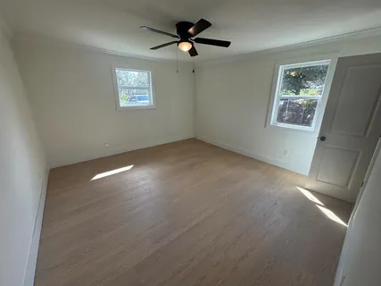 a view of an empty room with a window