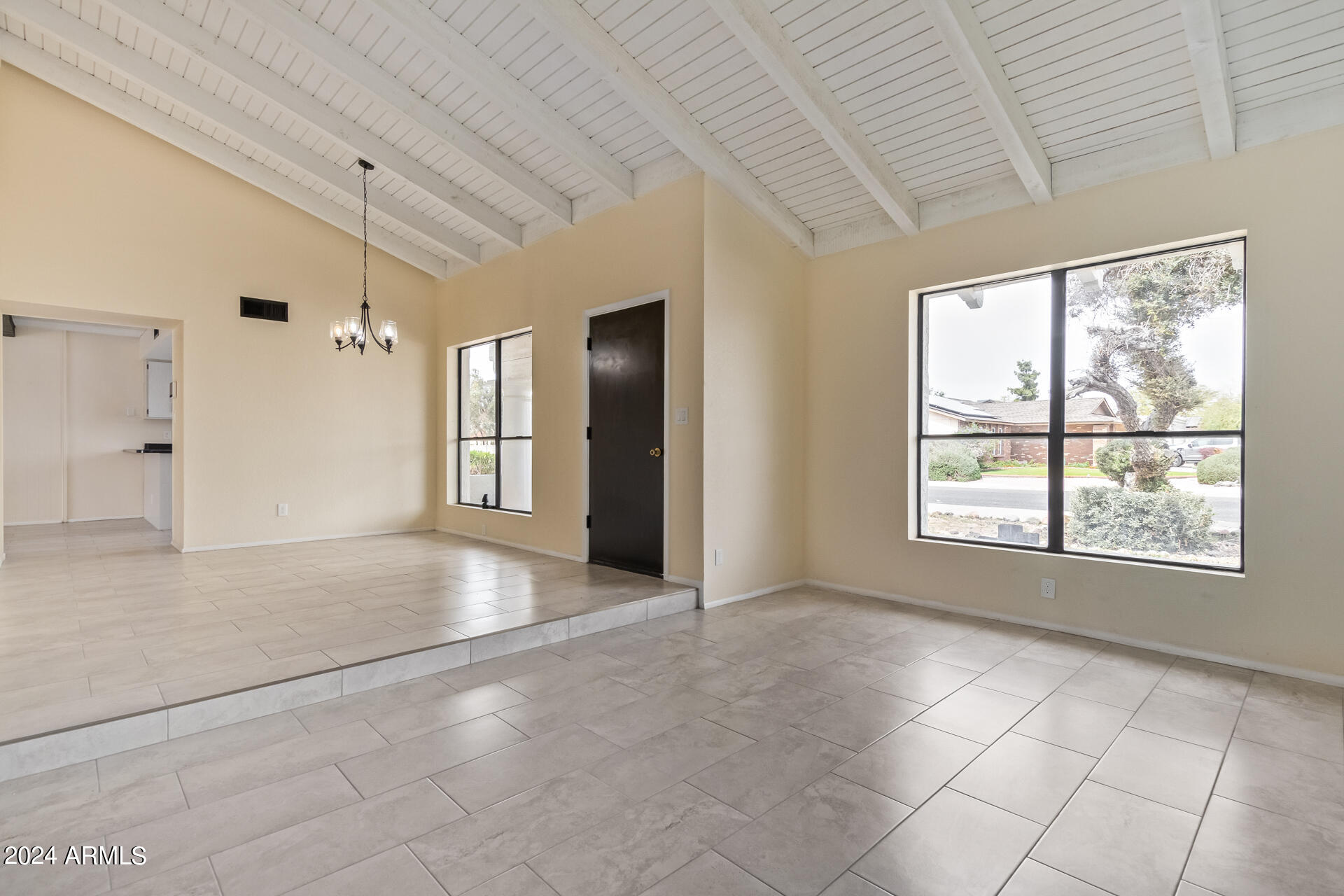 3917 West Juniper Avenue Phoenix, AZ 85053 - Photo 11 of 44 a view of an empty room with a window