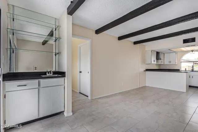 a view of cabinets and wooden floor