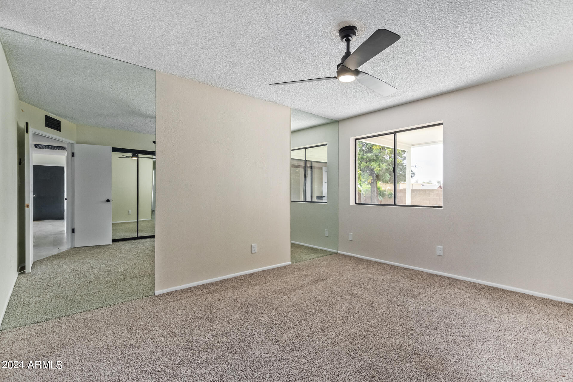 3917 West Juniper Avenue Phoenix, AZ 85053 - Photo 28 of 44 a view of an empty room with a window