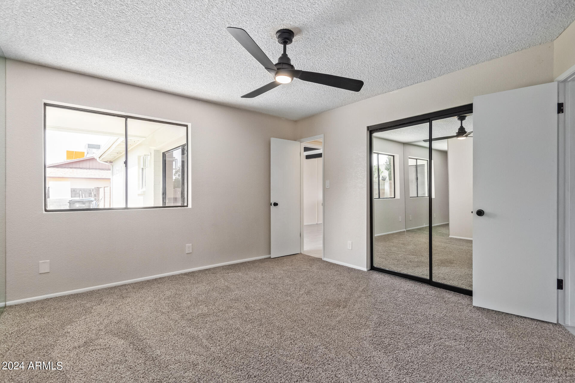 3917 West Juniper Avenue Phoenix, AZ 85053 - Photo 29 of 44 a view of an empty room with a window
