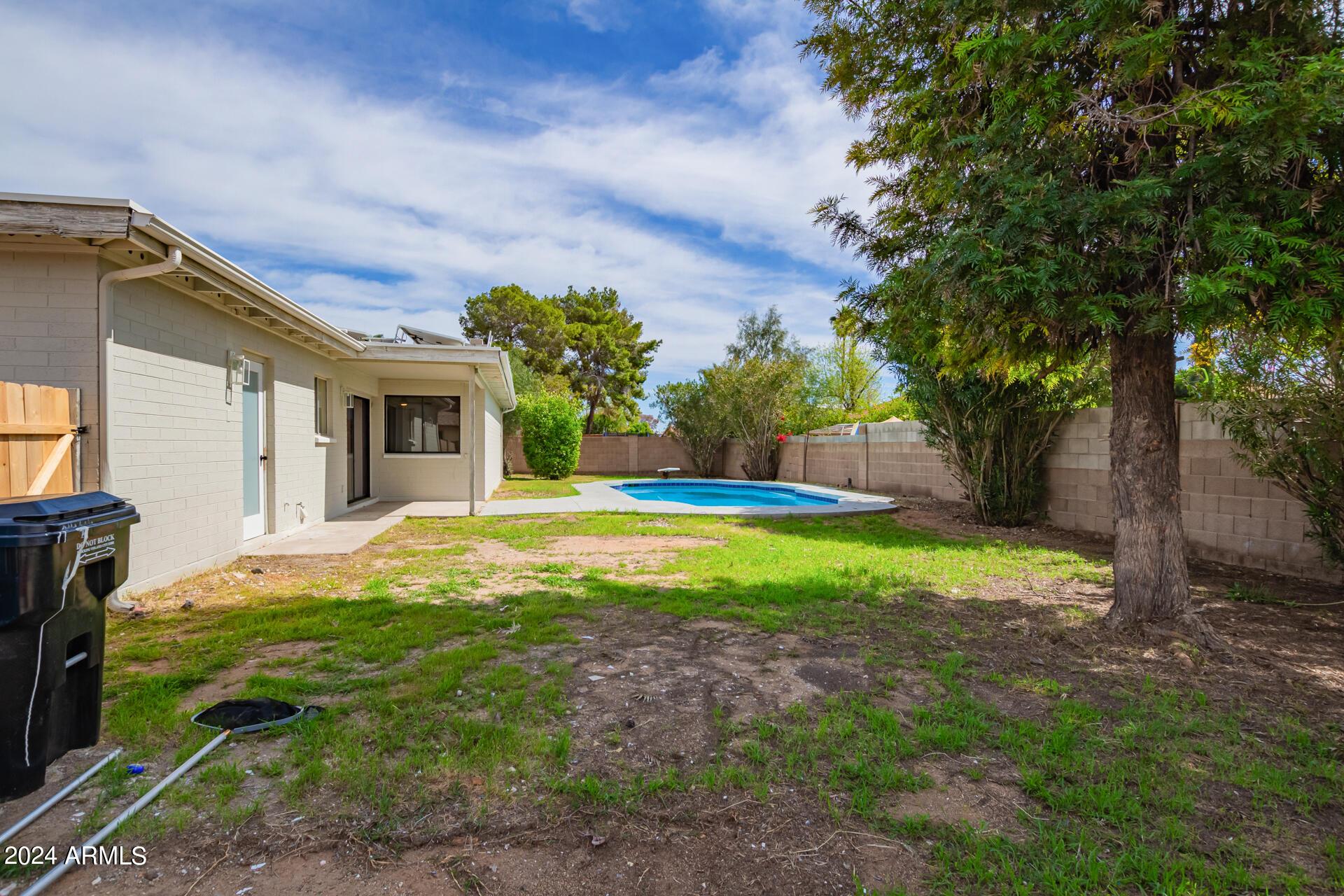 3917 West Juniper Avenue Phoenix, AZ 85053 - Photo 38 of 44 a view of a house with backyard and a tree
