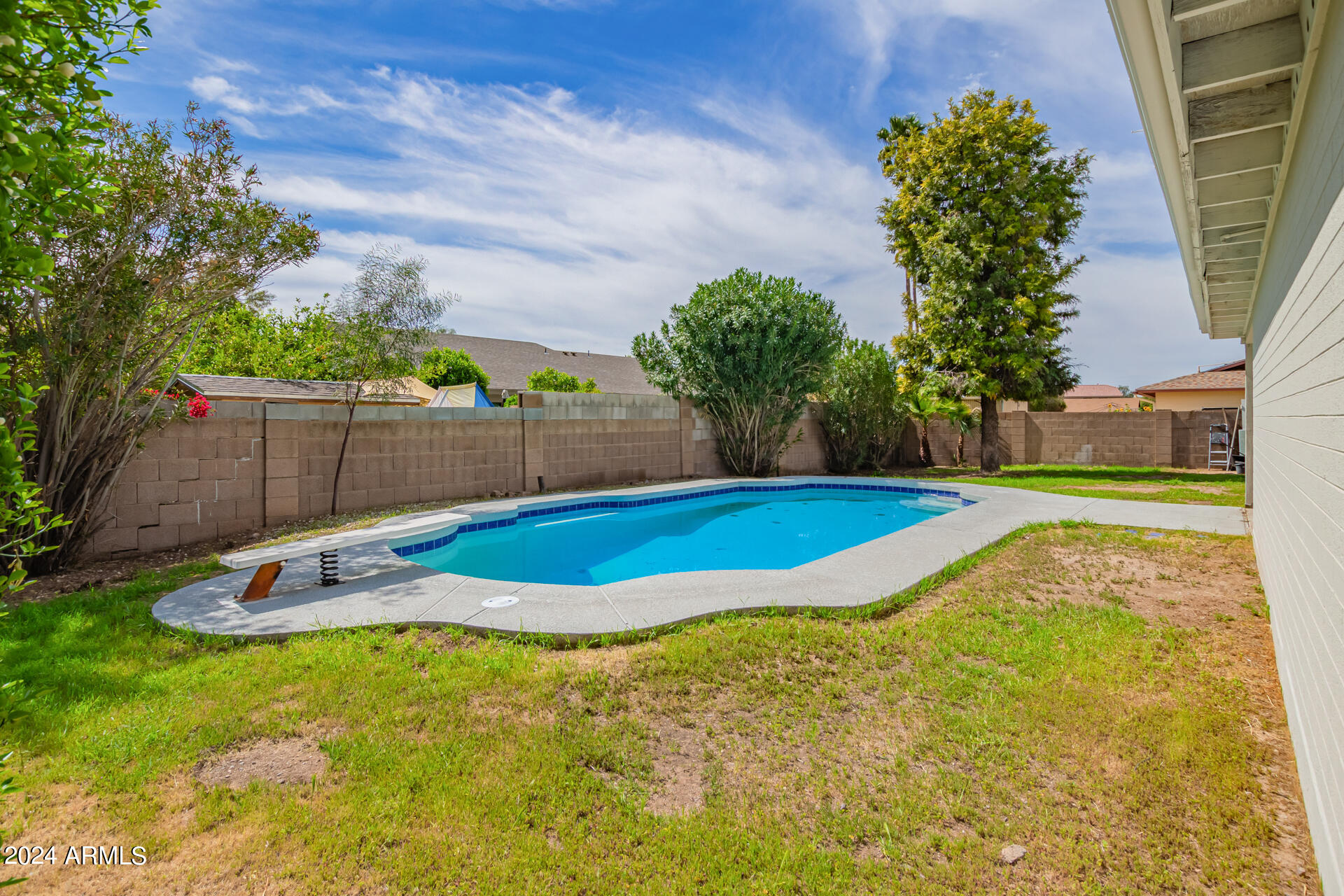 3917 West Juniper Avenue Phoenix, AZ 85053 - Photo 42 of 44 a view of a backyard with swimming pool