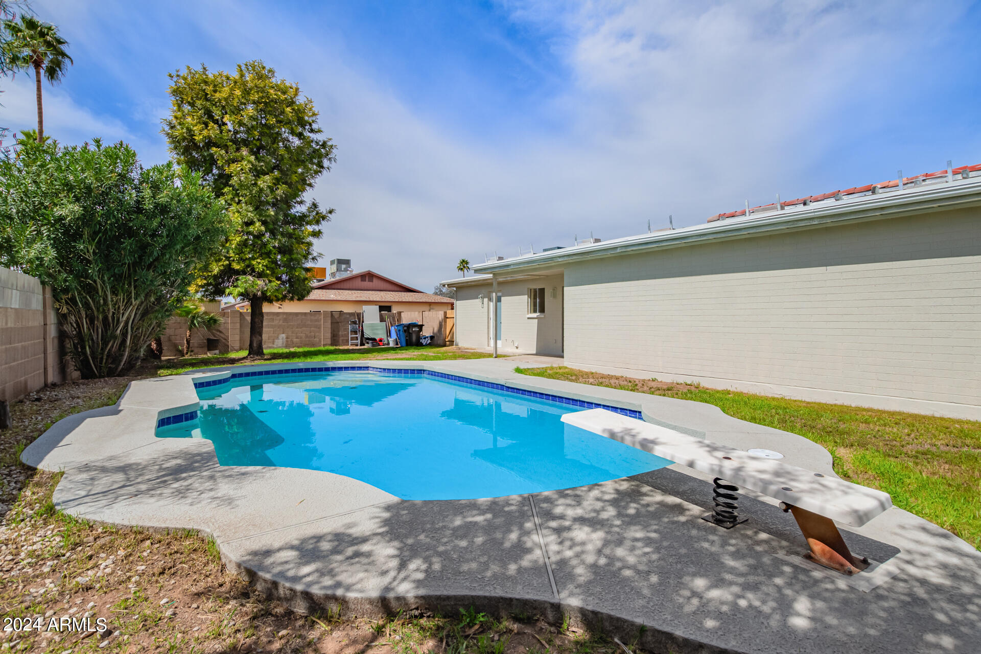 3917 West Juniper Avenue Phoenix, AZ 85053 - Photo 43 of 44 a view of a swimming pool with a yard