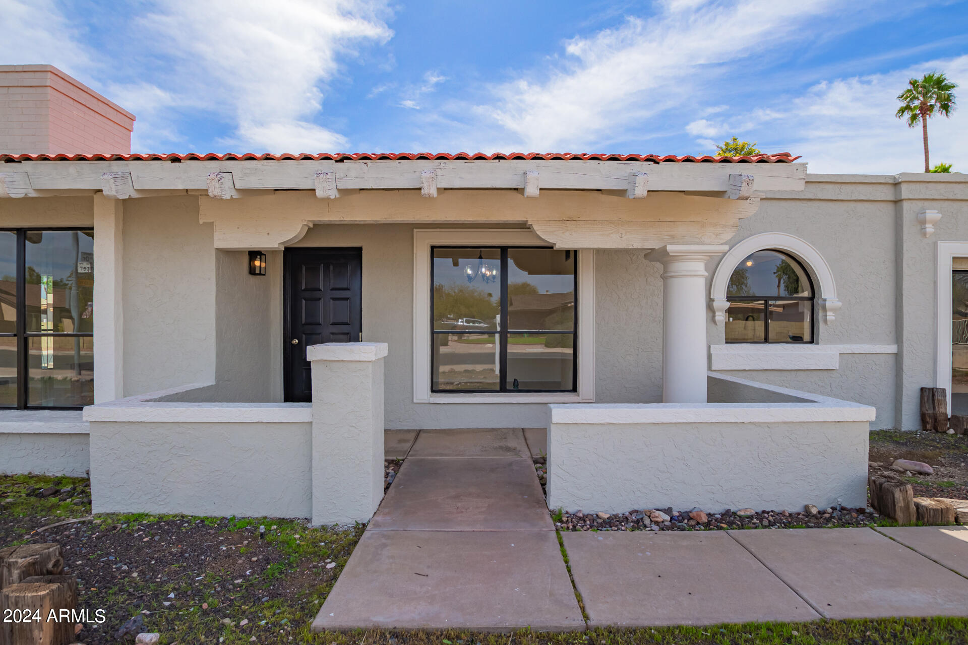 3917 West Juniper Avenue Phoenix, AZ 85053 - Photo 5 of 44 a front view of a house with a yard