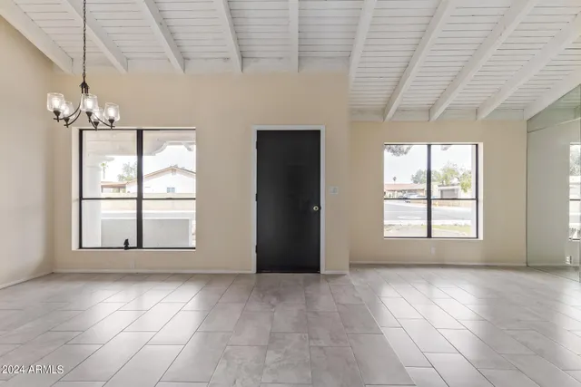 a view of an empty room with a window