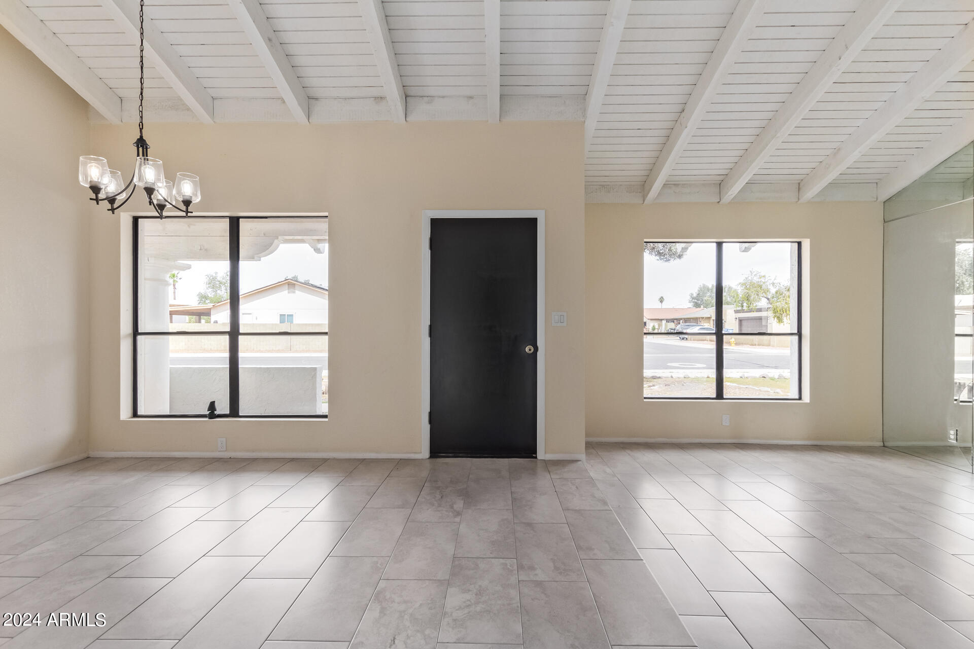 3917 West Juniper Avenue Phoenix, AZ 85053 - Photo 6 of 44 a view of an empty room with a window