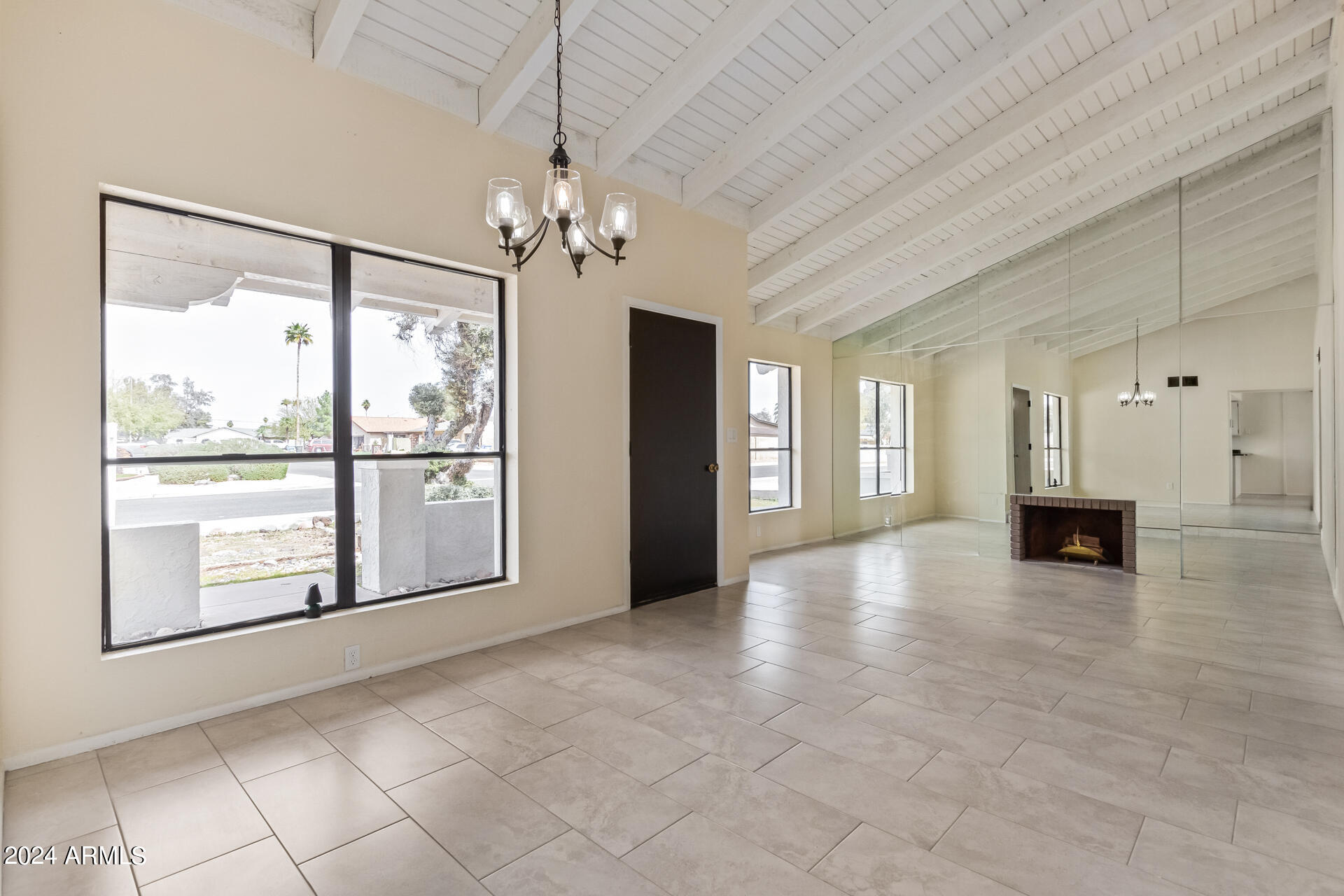3917 West Juniper Avenue Phoenix, AZ 85053 - Photo 8 of 44 a view of an empty room with a window