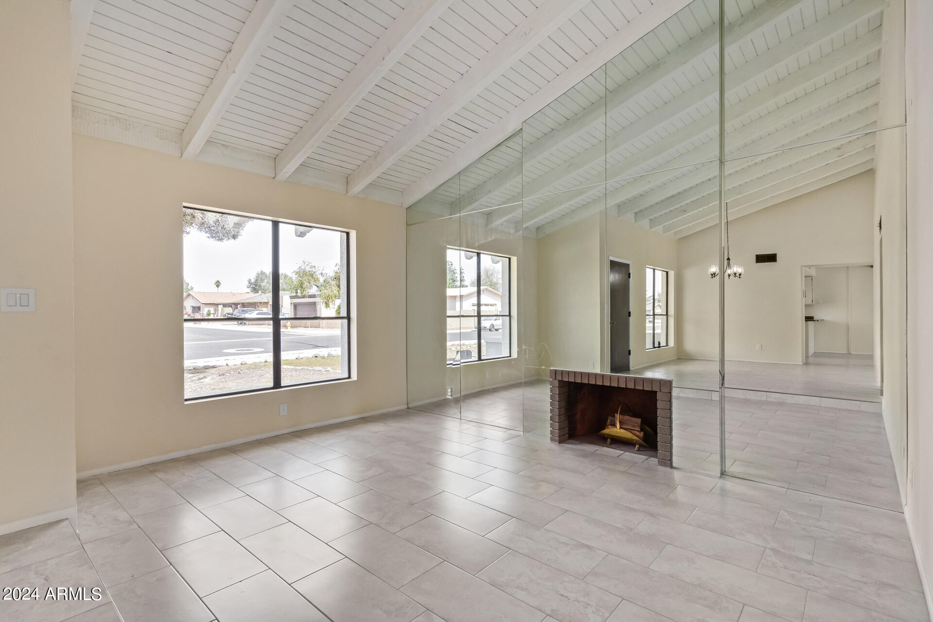 3917 West Juniper Avenue Phoenix, AZ 85053 - Photo 10 of 44 a view of an empty room with a window
