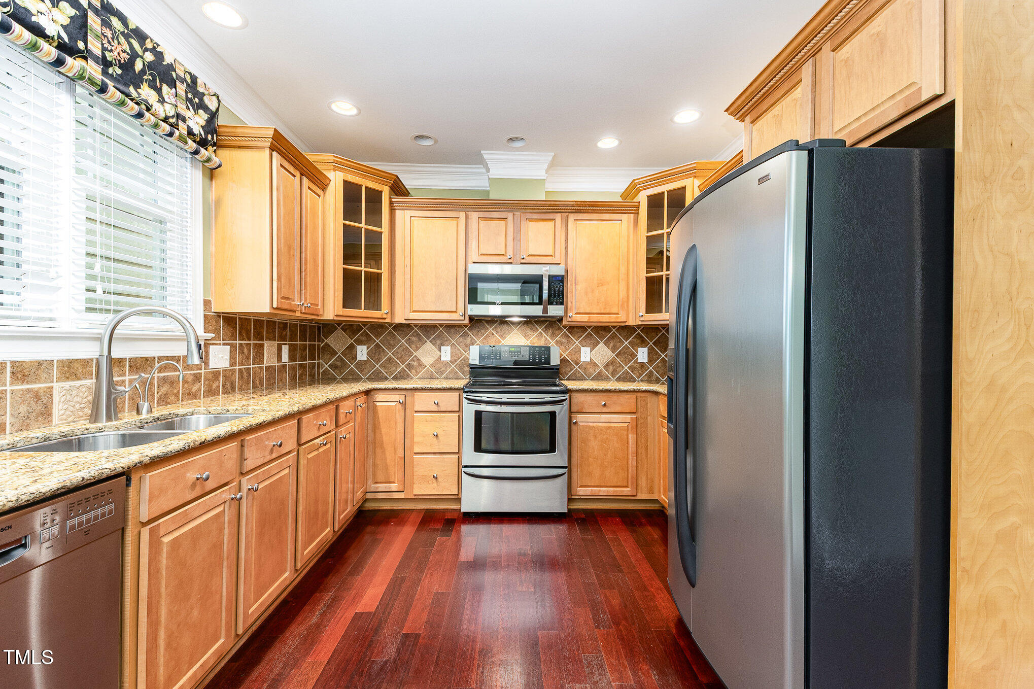 2201 Karns Place Raleigh, NC 27614 - Photo 10 of 31 a kitchen with stainless steel appliances a refrigerator sink and cabinets