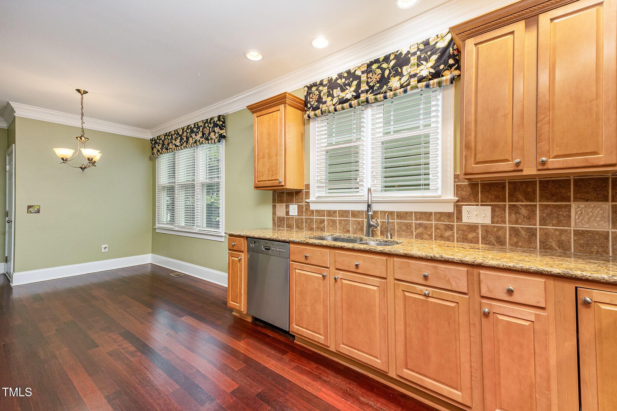 2201 Karns Place Raleigh, NC 27614 - Photo 12 of 31 a view of a kitchen with granite countertop a sink and dishwasher wooden cabinets with wooden floor