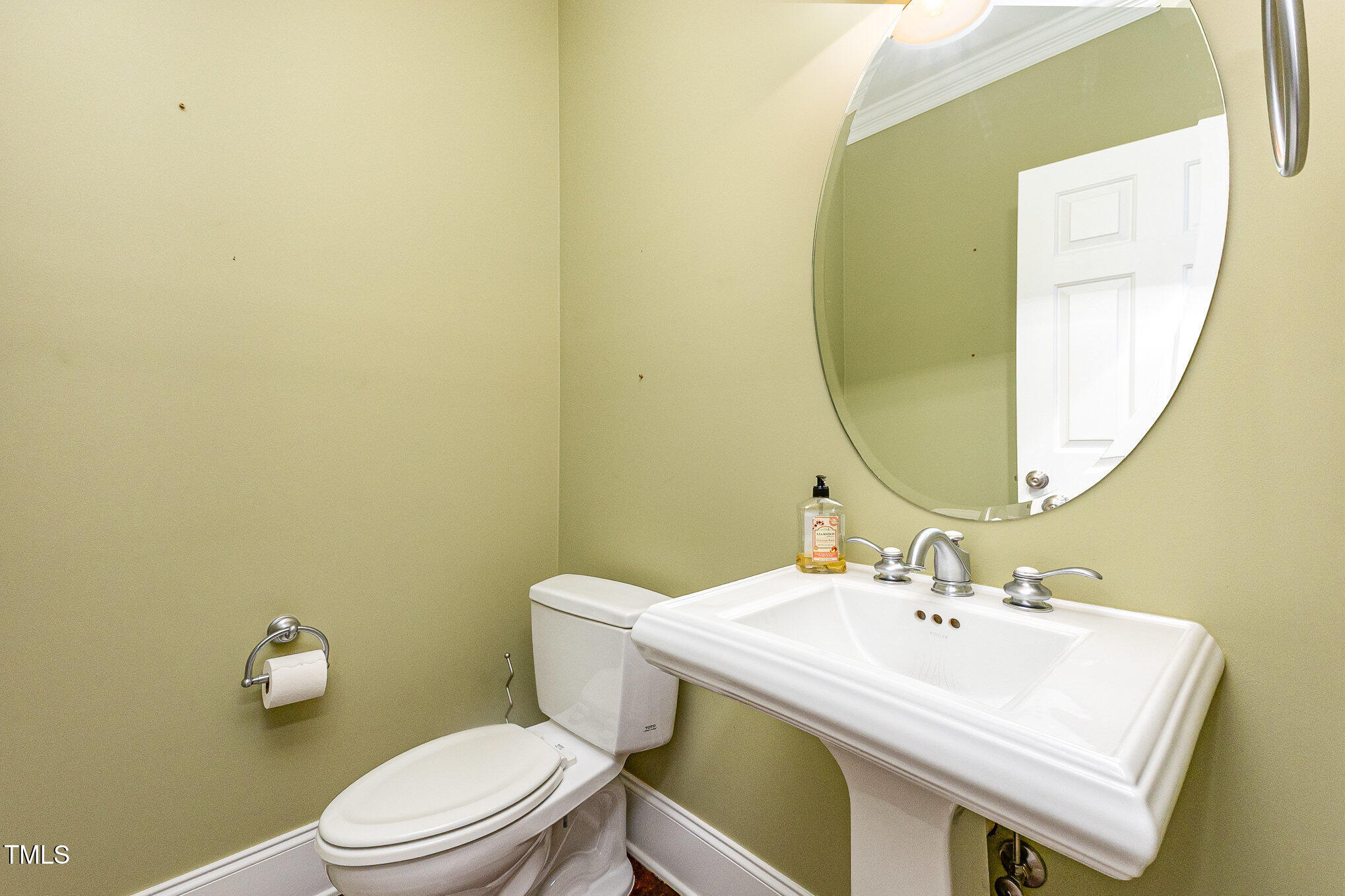 2201 Karns Place Raleigh, NC 27614 - Photo 14 of 31 a bathroom with a sink mirror and toilet