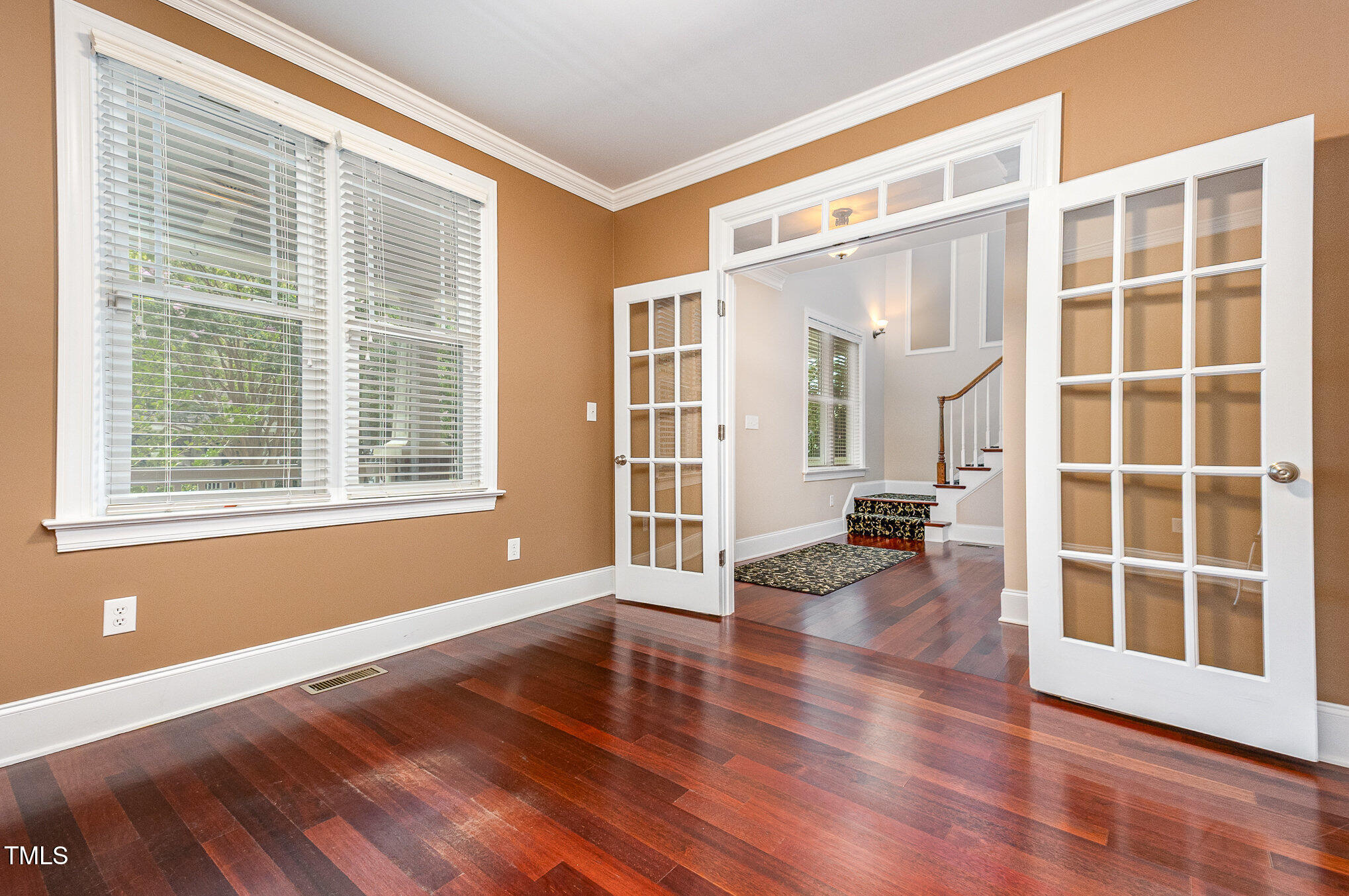 2201 Karns Place Raleigh, NC 27614 - Photo 4 of 31 a view of empty room with wooden floor and windows