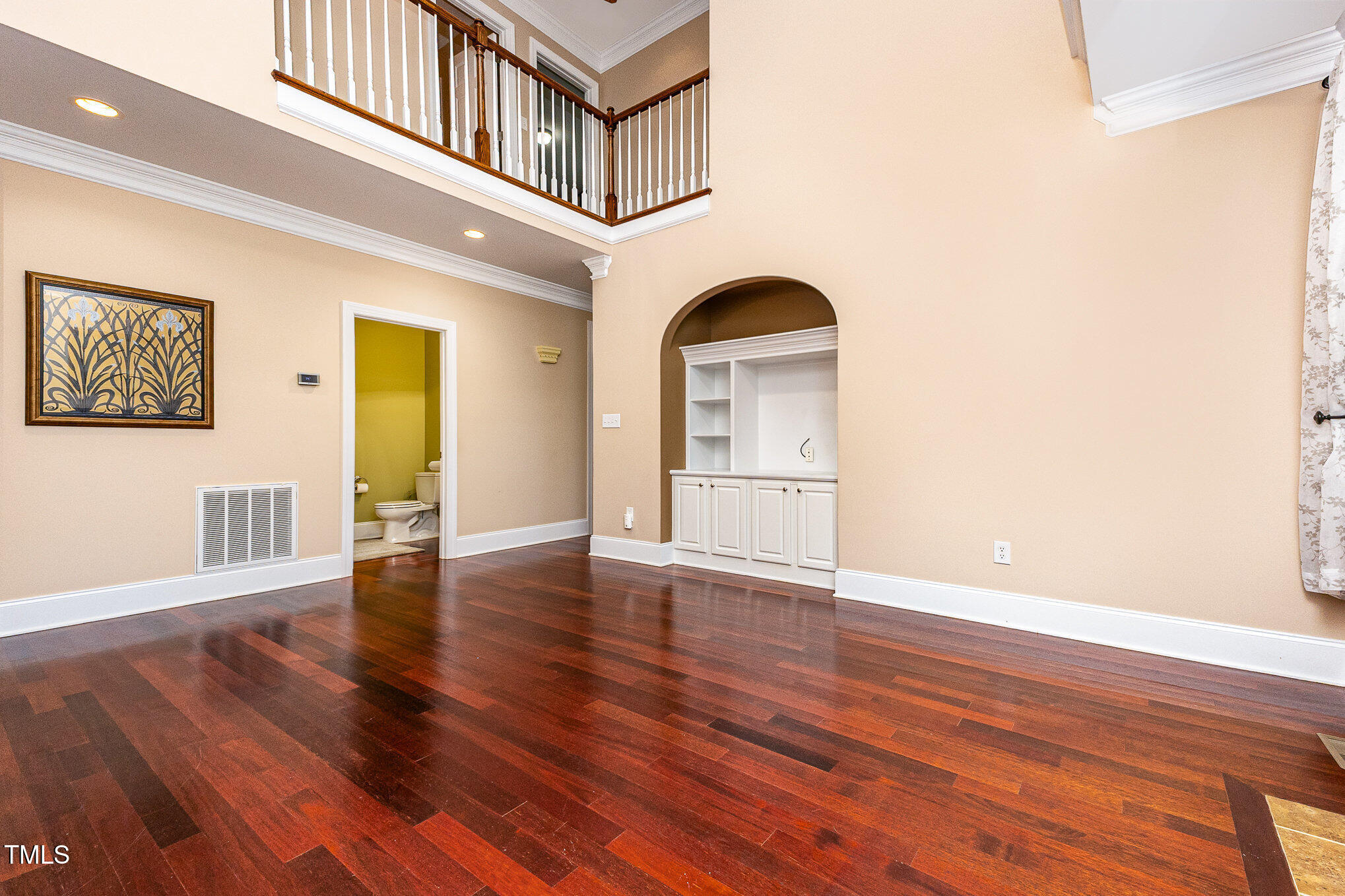 2201 Karns Place Raleigh, NC 27614 - Photo 7 of 31 a view of an empty room with wooden floor and a window