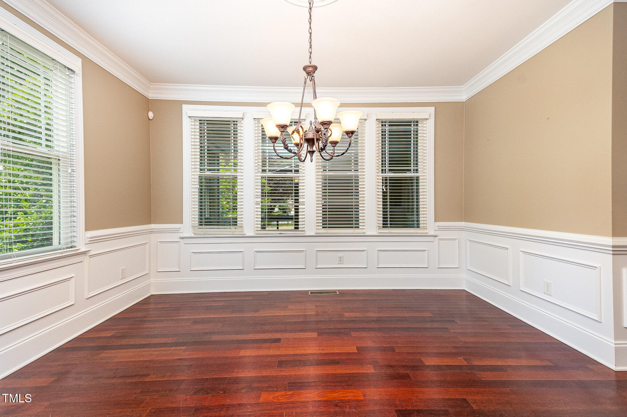2201 Karns Place Raleigh, NC 27614 - Photo 8 of 31 a view of empty room with wooden floor and large window