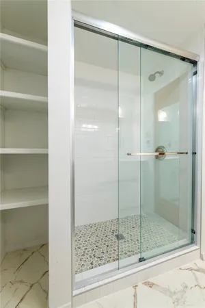 a bathroom with a shower and toilet