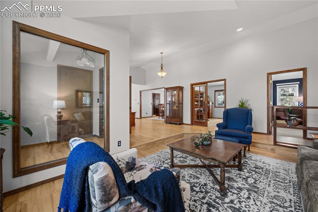 17815 Saddlewood Road Monument, CO 80132 - Photo 13 of 40 a living room with furniture and a wooden floor