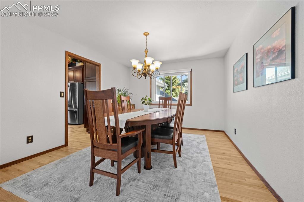 17815 Saddlewood Road Monument, CO 80132 - Photo 17 of 40 a dining room with furniture and window