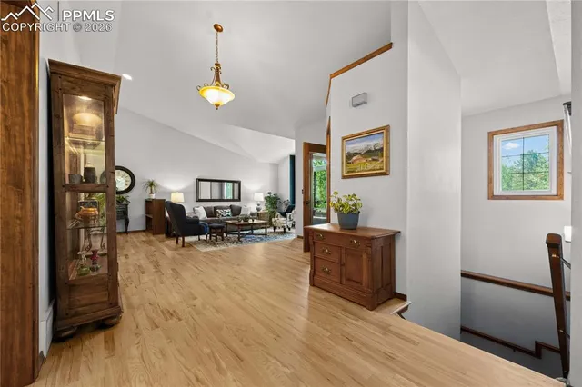 a view of a livingroom with furniture and workspace