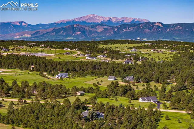 a view of a city with mountains in the background