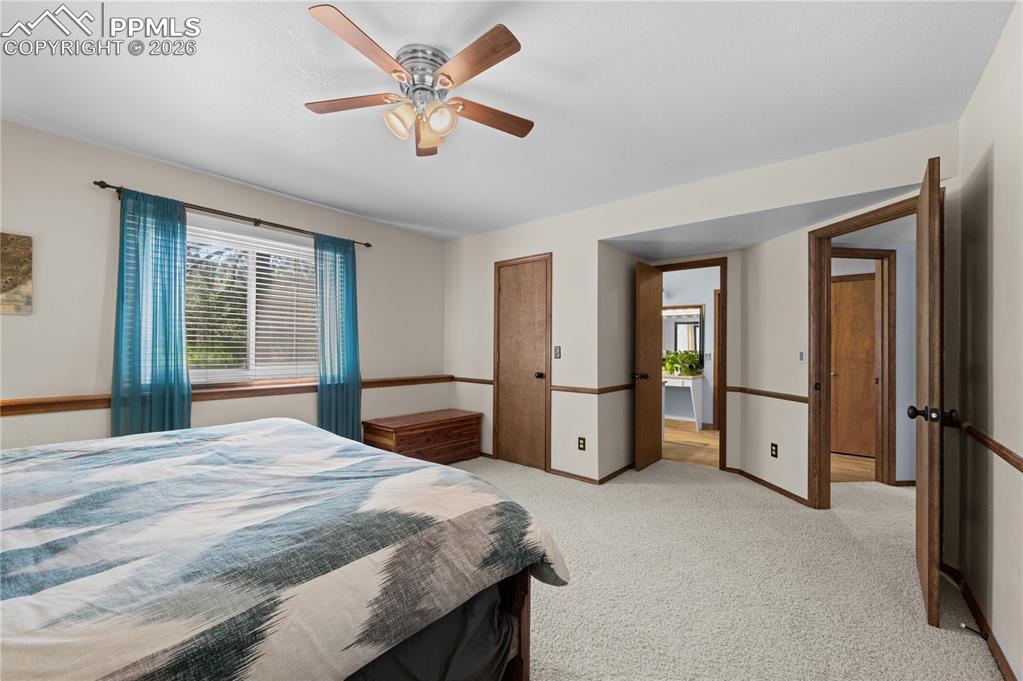 17815 Saddlewood Road Monument, CO 80132 - Photo 21 of 40 a bedroom with a bed and a window