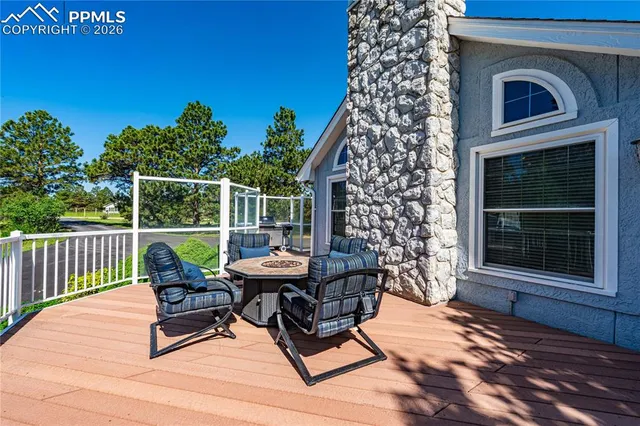 a view of a patio with wooden floor