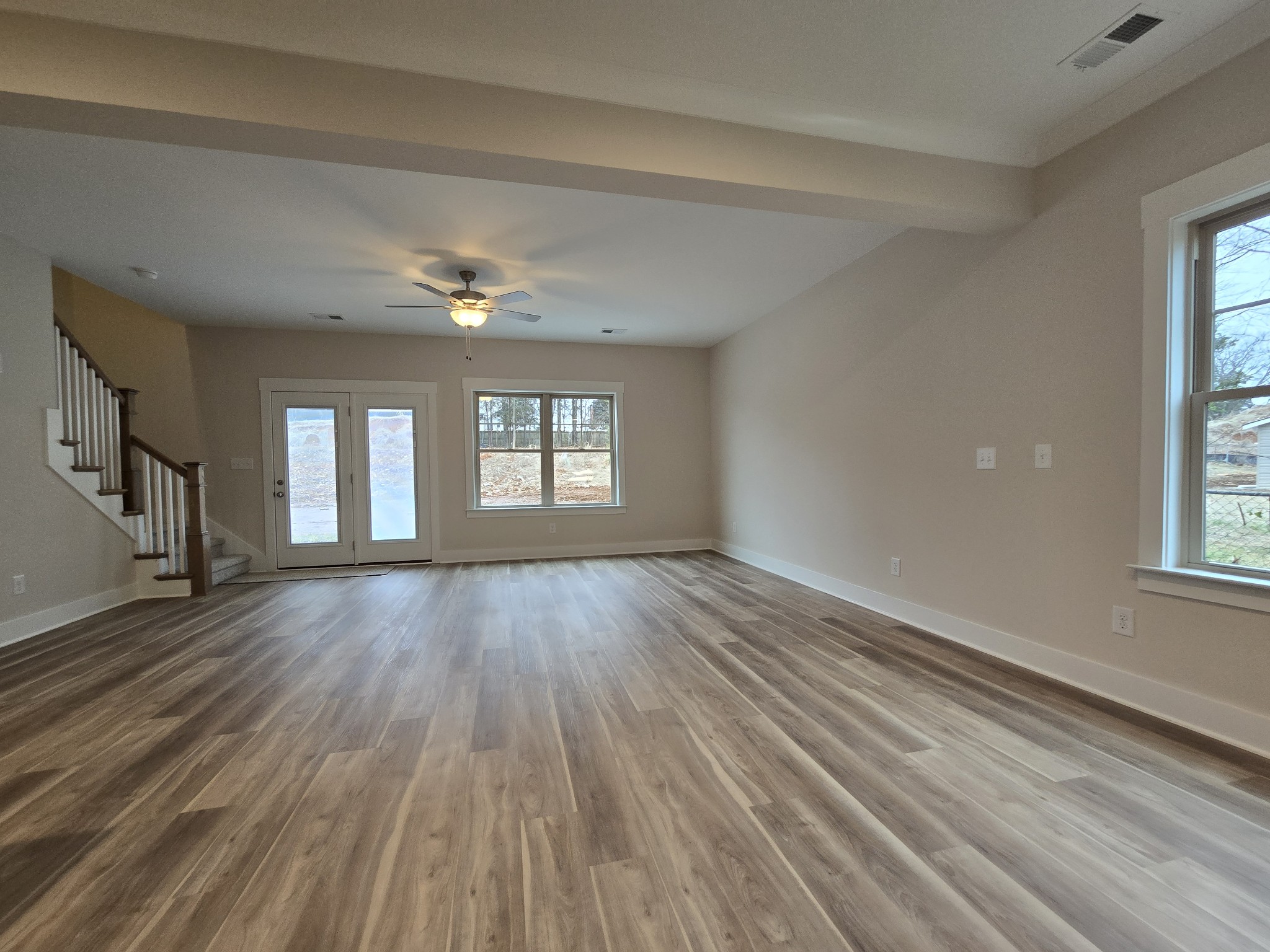 324 Chaney Road, Unit 5 Smyrna, TN 37167 - Photo 13 of 19 a view of an empty room with wooden floor and a window