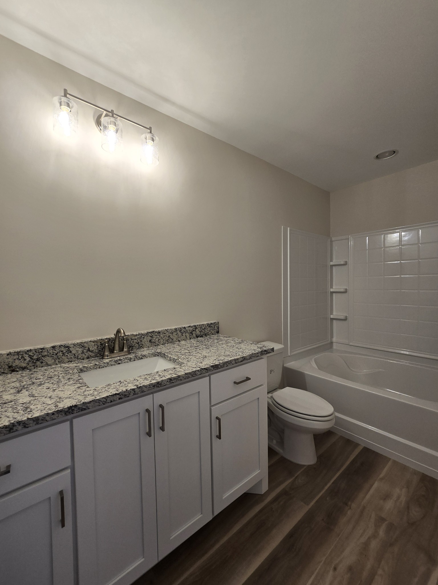 324 Chaney Road, Unit 5 Smyrna, TN 37167 - Photo 15 of 19 a bathroom with a granite countertop sink a toilet and shower