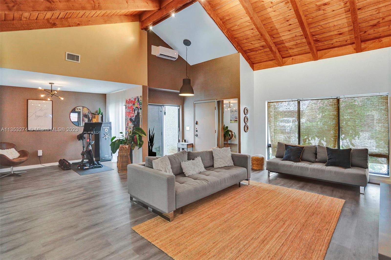 1037 Northeast 202nd Lane Miami, FL 33179 - Photo 1 of 21 a living room with furniture and wooden floor