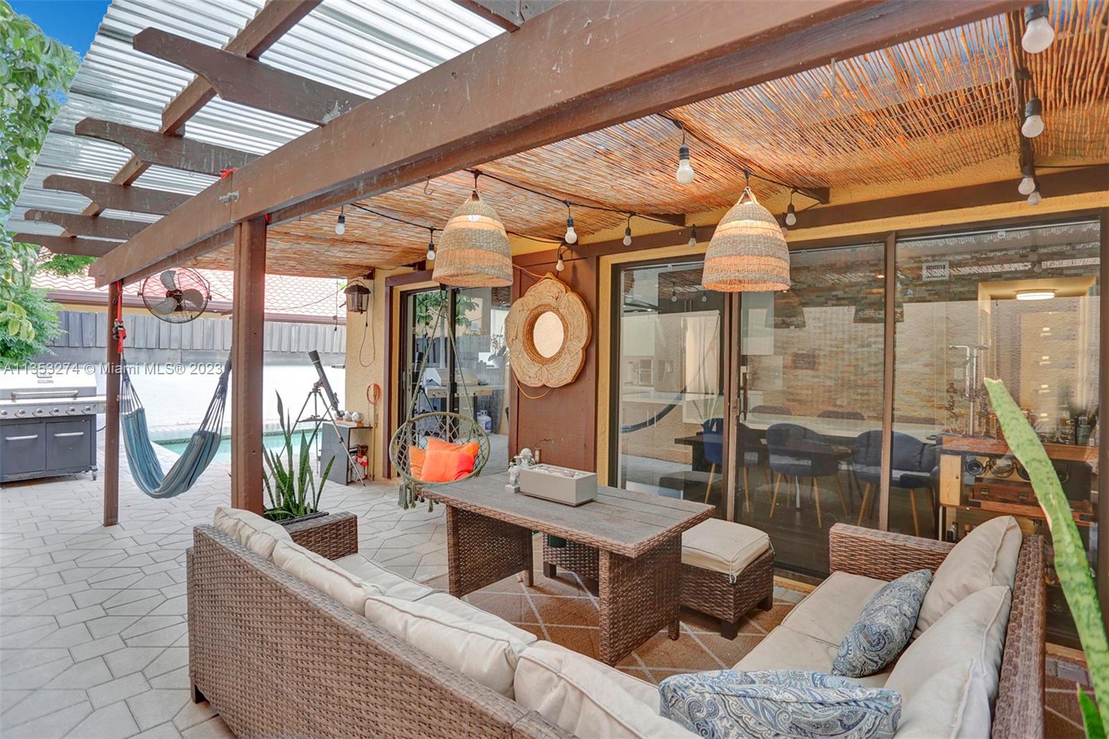 1037 Northeast 202nd Lane Miami, FL 33179 - Photo 17 of 21 a living room with fireplace furniture and a large window