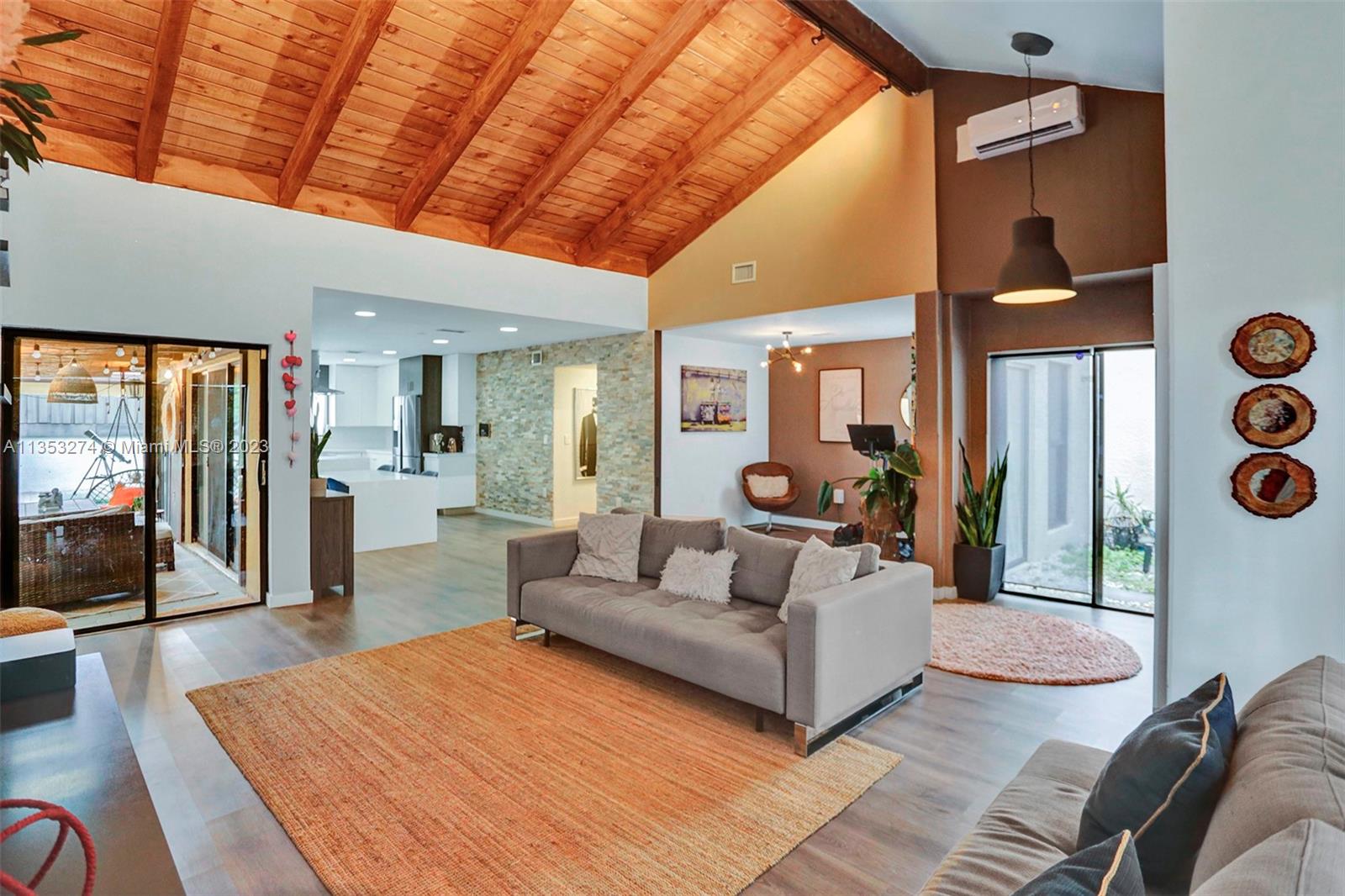 1037 Northeast 202nd Lane Miami, FL 33179 - Photo 3 of 21 a living room with furniture and a large window