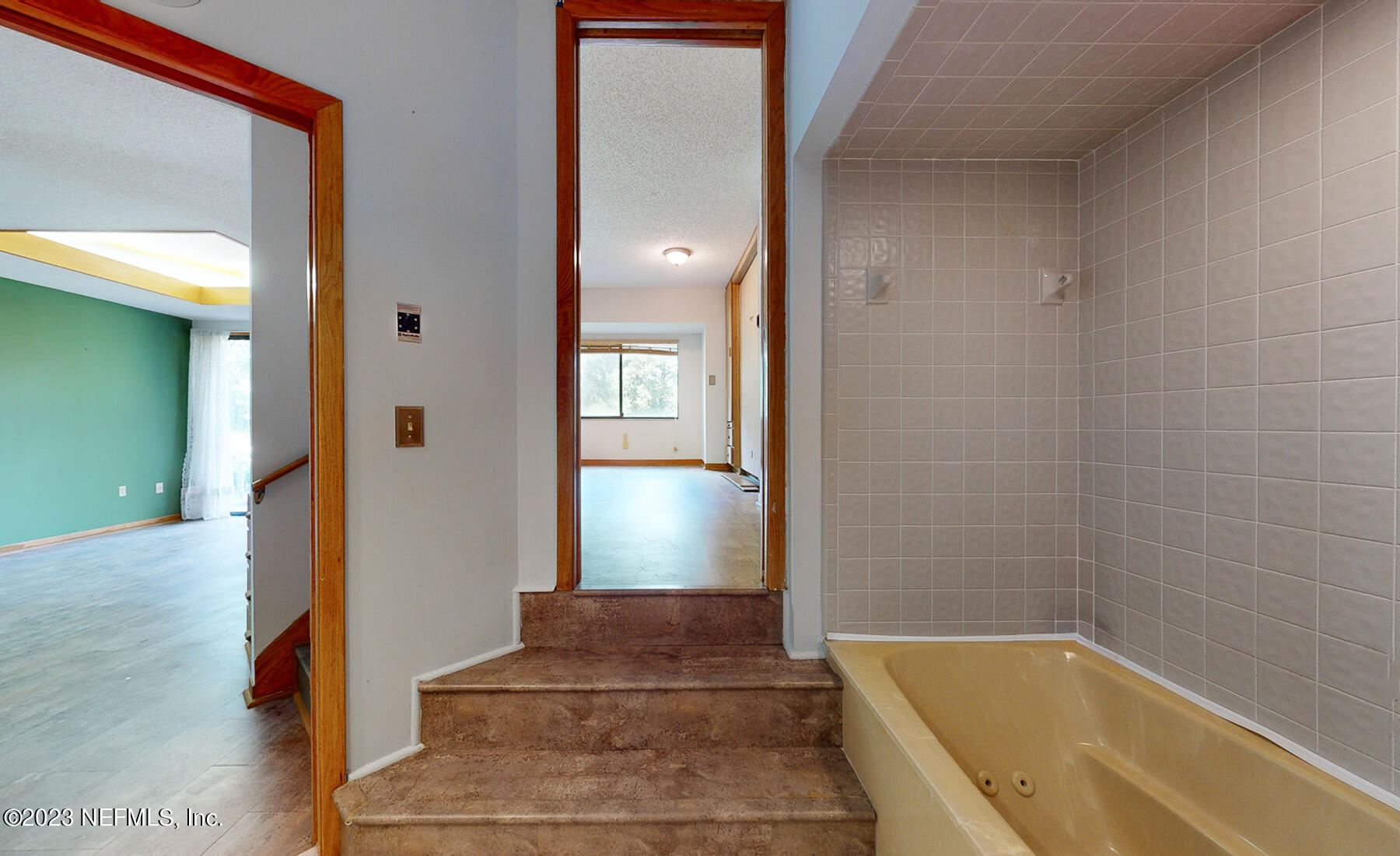 2910 Ravines Road, Unit 1102 Middleburg, FL 32068 - Photo 13 of 43 a view of a bathroom with bathtub