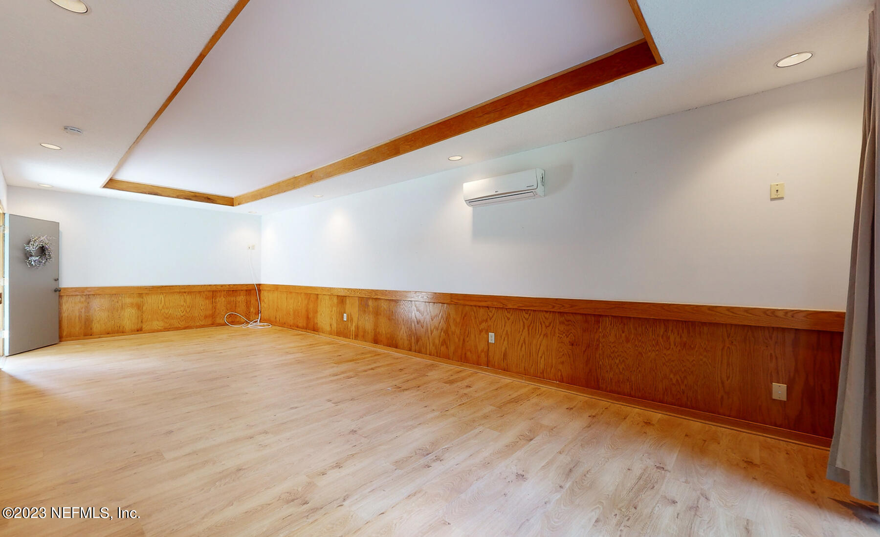 2910 Ravines Road, Unit 1102 Middleburg, FL 32068 - Photo 15 of 43 a view of an empty room with wooden floor