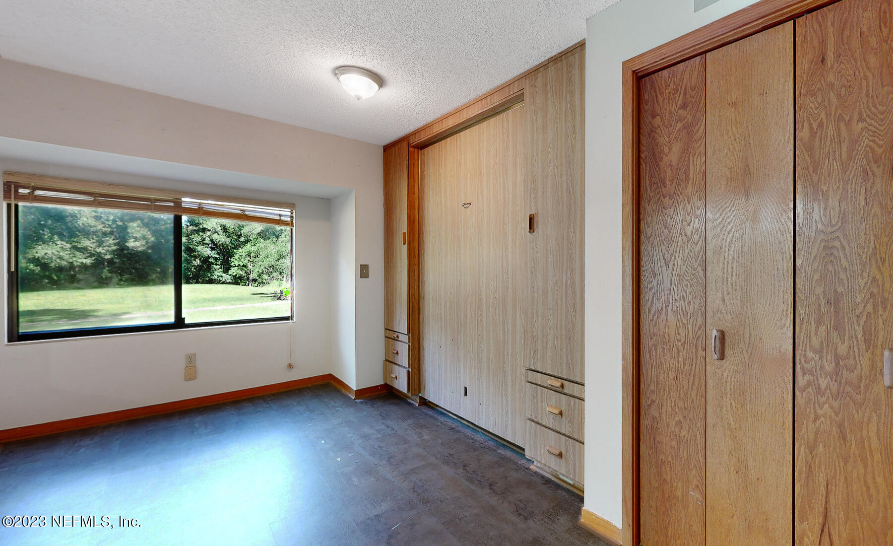 2910 Ravines Road, Unit 1102 Middleburg, FL 32068 - Photo 18 of 43 wooden floor in an empty room with a window