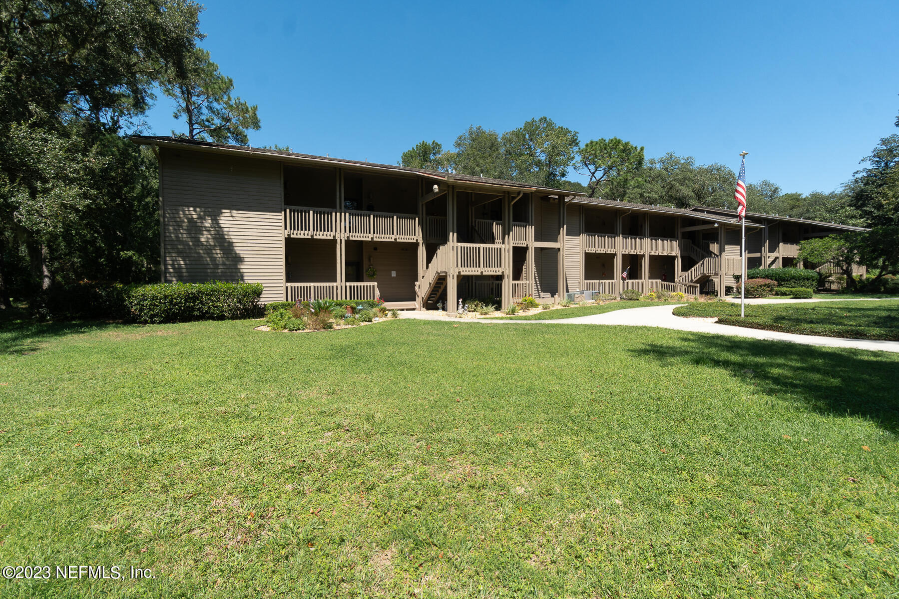 2910 Ravines Road, Unit 1102 Middleburg, FL 32068 - Photo 26 of 43 a front view of house with yard and green space