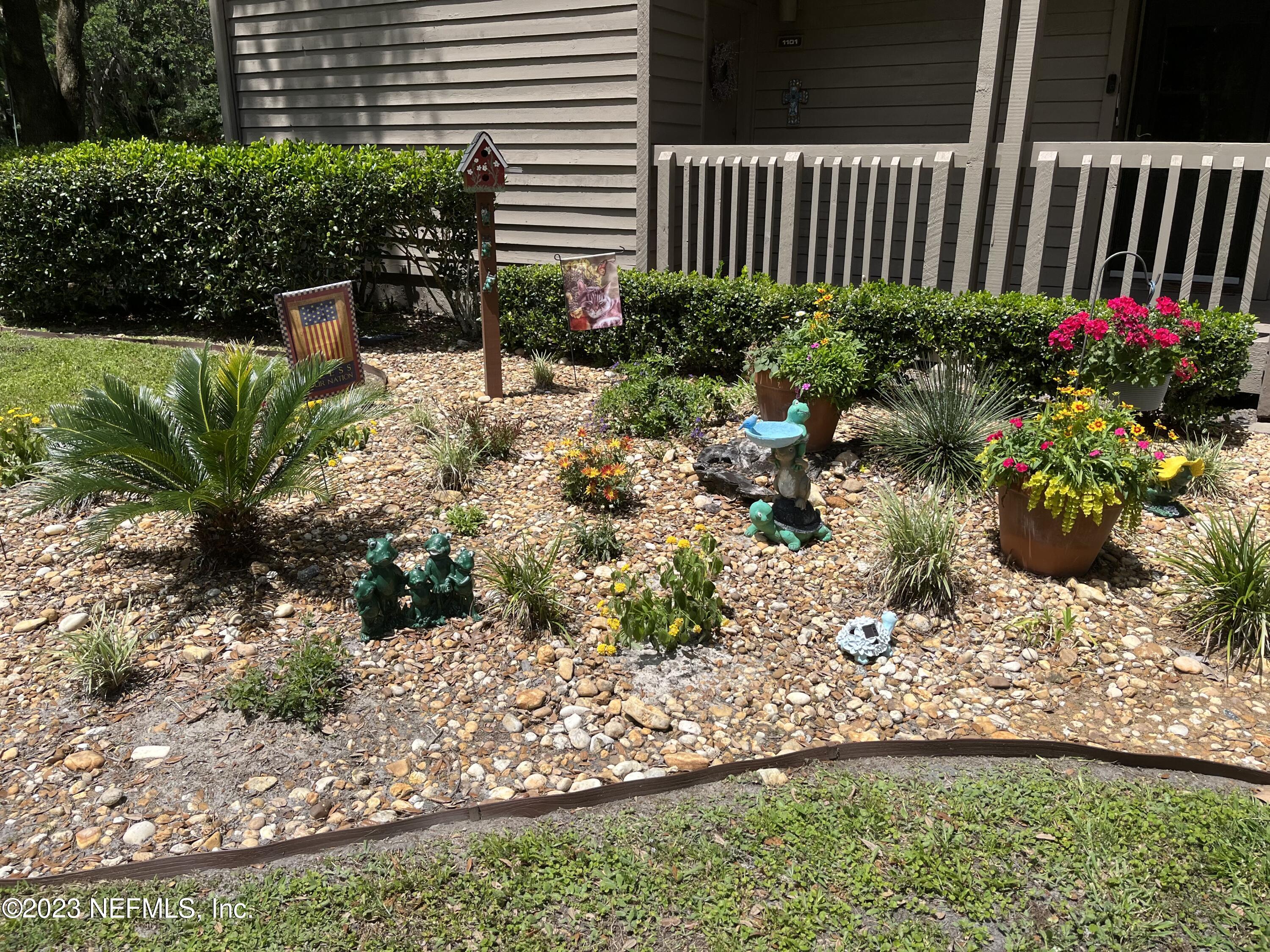 2910 Ravines Road, Unit 1102 Middleburg, FL 32068 - Photo 38 of 43 a garden with plants and flowers
